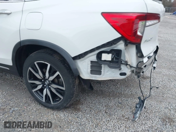 2020 Honda Pilot Touring 8-Passenger with VIN 5FNYF6H96LB056229, listed as a IAAI auction lot 41738249 with 65,099 mi miles and . Bid and sale history available at DreamBid. Image 22.