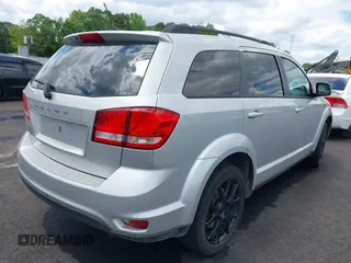 2014 Dodge Journey SXT with VIN 3C4PDCBB0ET281861, listed as a IAAI auction lot 42187485 with 124,191 mi miles and . Bid and sale history available at DreamBid. Image 4.