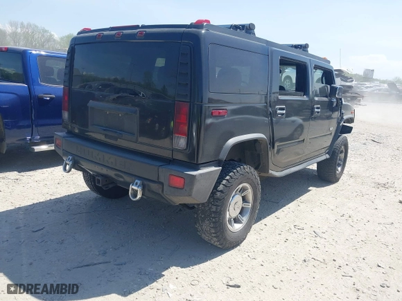 2005 Hummer H2 SUV with VIN 5GRGN23U25H128791, listed as a IAAI auction lot 42115436 with 286,818 mi miles. Bid and sale history available at carsss.com. Image 4.