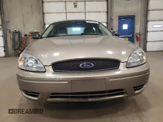 2005 Ford Taurus SE with VIN 1FAFP53U15A276082, listed as a Copart auction lot 52015285 with 103,479 mi miles and Salvage Title. Bid and sale history available at carsss.com. Image 5.