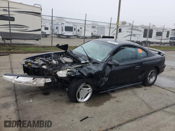 1997 Ford Mustang with VIN 1FALP4049VF136060, listed as a Copart auction lot 85389824 with 0 mi miles and Salvage Title. Bid and sale history available at carsss.com. Image 1.