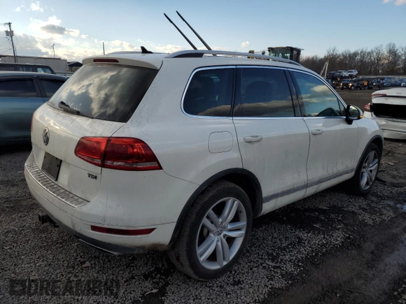 2012 Volkswagen Touareg Sport z VIN WVGFK9BP6CD002427, wystawiony jako Copart lot #42576335 z przebiegiem 167 936 mil mil oraz Szkoda całkowita • Salvage title. Historia ofert i sprzedaży dostępna na DreamBid. Obrazek 3.