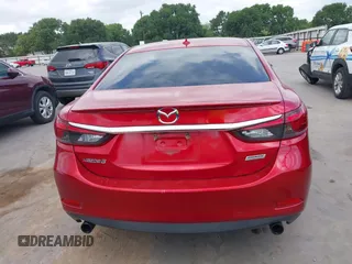 2016 Mazda 6 i Grand Touring z VIN JM1GJ1W58G1486694, wystawiony jako IAAI lot #42094443 z przebiegiem 77 803 mil mil oraz . Historia ofert i sprzedaży dostępna na DreamBid. Obrazek 16.