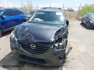 2016 Mazda CX-5 Grand Touring with VIN JM3KE4DY7G0643643, listed as a IAAI auction lot 42077497 with 120,343 mi miles. Bid and sale history available at carsss.com. Image 12.