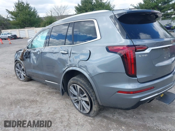 2020 Cadillac XT6 FWD Premium Luxury z VIN 1GYKPCRS9LZ129763, wystawiony jako IAAI lot #42052532 z przebiegiem 57 670 mil mil oraz . Historia ofert i sprzedaży dostępna na DreamBid. Obrazek 3.