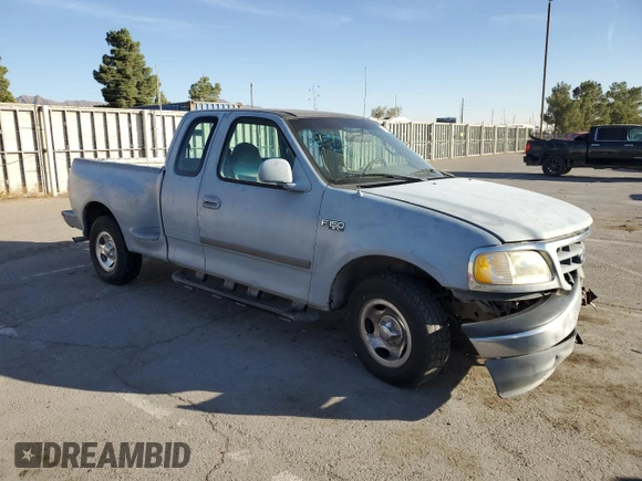 2000 Ford F-150 XL with VIN 1FTZX0723YKA02769, listed as a Copart auction lot 78722714 with 354,312 mi miles and Salvage title. Bid and sale history available at DreamBid. Image 4.