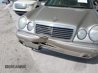 1999 Mercedes-Benz E-Class with VIN WDBJH65F3XA845635, listed as a IAAI auction lot 42102122 with 215,678 mi miles. Bid and sale history available at carsss.com. Image 6.