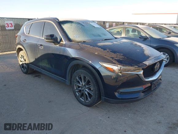 2019 Mazda CX-5 Signature with VIN JM3KFBEY5K0656965, listed as a IAAI auction lot 41421453 with 99,073 mi miles. Bid and sale history available at carsss.com. Image 6.