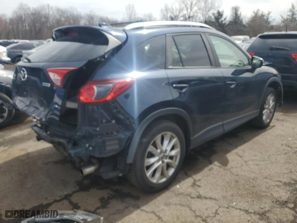 2015 Mazda CX-5 Grand Touring with VIN JM3KE4DY7F0491930, listed as a Copart auction lot 50995415 with 102,013 mi miles and Salvage Title. Bid and sale history available at carsss.com. Image 3.
