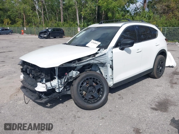 2021 Mazda CX-5 Signature with VIN JM3KFBEY0M0436264, listed as a IAAI auction lot 41568892 with 36,833 mi miles. Bid and sale history available at carsss.com. Image 2.