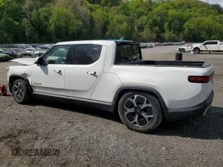 2022 Rivian R1T Adventure z VIN 7FCTGAAA8NN016263, wystawiony jako Copart lot #55668845 z przebiegiem 27 864 mil mil oraz Szkody całkowita. Historia ofert i sprzedaży dostępna na DreamBid. Obrazek 2.