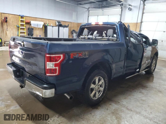 2018 Ford F-150 XL with VIN 1FTFX1E57JFE75983, listed as a Copart auction lot 52619685 with 184,124 mi miles and Clean title. Bid and sale history available at DreamBid. Image 3.