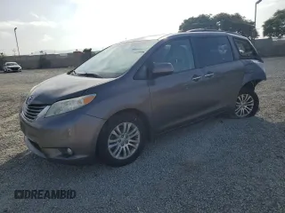 2014 Toyota Sienna XLE with VIN 5TDYK3DC7ES442474, listed as a Copart auction lot 63447465 with 61,453 mi miles and Salvage title. Bid and sale history available at DreamBid. Image 1.