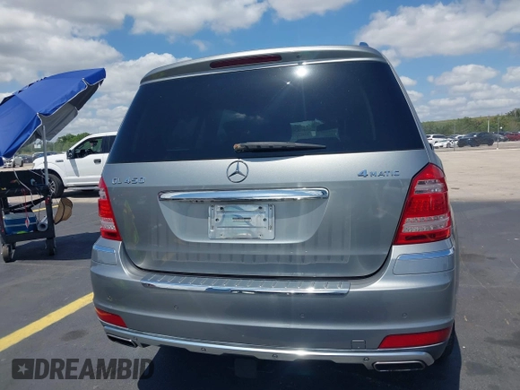 2012 Mercedes-Benz GL 450 z VIN 4JGBF7BE1CA800793, wystawiony jako IAAI lot #42312472 z przebiegiem 155 847 mil mil oraz . Historia ofert i sprzedaży dostępna na DreamBid. Obrazek 17.