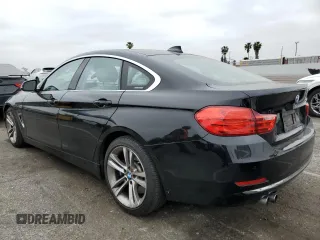2015 BMW 4 Series 428i with VIN WBA4A5C59FGK15506, listed as a Copart auction lot 54249435 with 27,883 mi miles and Salvage title. Bid and sale history available at DreamBid. Image 2.