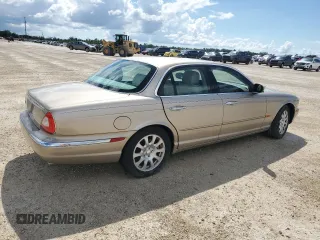 2004 Jaguar XJ with VIN SAJWA71C24SG28164, listed as a Copart auction lot 73968134 with 0 mi miles and Salvage Title. Bid and sale history available at carsss.com. Image 3.