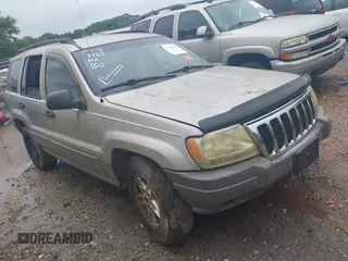 2003 Jeep Grand Cherokee Laredo z VIN 1J4GW48S33C599693, wystawiony jako IAAI lot #42228885 z przebiegiem 257 551 mil mil oraz . Historia ofert i sprzedaży dostępna na DreamBid. Obrazek 1.