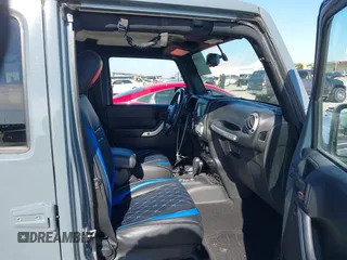 2015 Jeep Wrangler Unlimited Rubicon with VIN 1C4BJWFG7FL525724, listed as a IAAI auction lot 41394059 with 132,058 mi miles. Bid and sale history available at carsss.com. Image 5.