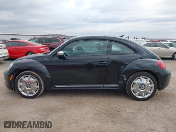 2013 Volkswagen Beetle 2.5L with VIN 3VWJP7AT8DM679548, listed as a IAAI auction lot 41459613 with 135,198 mi miles and . Bid and sale history available at DreamBid. Image 14.