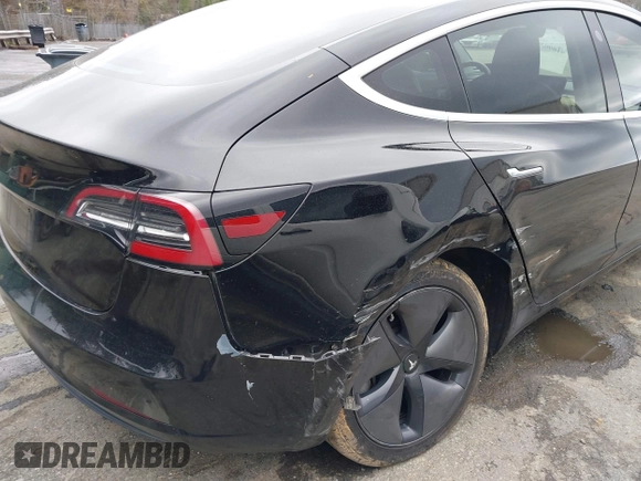 2019 Tesla Model 3 Mid Range with VIN 5YJ3E1EA3KF313425, listed as a IAAI auction lot 41806388 with 110,767 mi miles and . Bid and sale history available at carsss.com. Image 6.