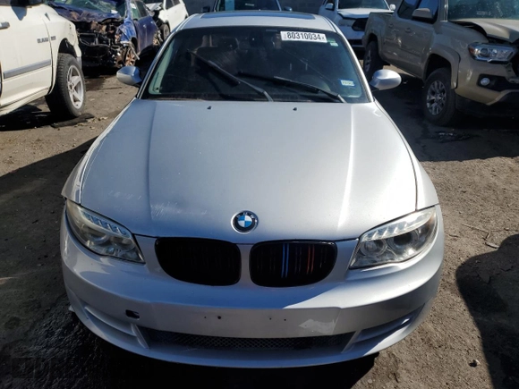 2009 BMW 1 Series 128i with VIN WBAUP93529VF48915, listed as a Copart auction lot 80310034 with 143,208 mi miles and Salvage title. Bid and sale history available at DreamBid. Image 5.