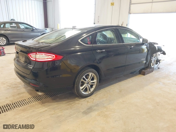 2016 Ford Fusion Titanium Hybrid with VIN 3FA6P0RU7GR127307, listed as a IAAI auction lot 41944427 with 128,076 mi miles. Bid and sale history available at carsss.com. Image 4.