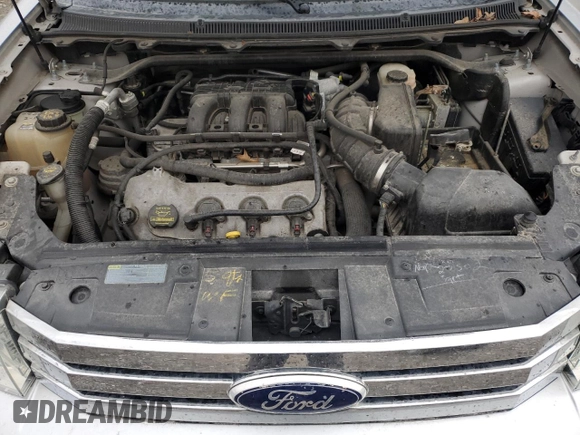 2012 Ford Flex SE z VIN 2FMGK5BC7CBD09346, wystawiony jako Copart lot #53385595 z przebiegiem 174 738 mil mil oraz Szkoda całkowita • Salvage title. Historia ofert i sprzedaży dostępna na DreamBid. Obrazek 13.