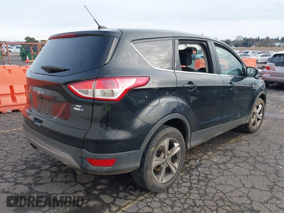 2016 Ford Escape SE with VIN 1FMCU9G97GUA30718, listed as a IAAI auction lot 41516857 with 167,576 mi miles and . Bid and sale history available at DreamBid. Image 4.