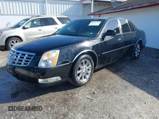 2008 Cadillac DTS 1SC with VIN 1G6KD57Y18U195569, listed as a IAAI auction lot 41936784 with 123,924 mi miles and . Bid and sale history available at carsss.com. Image 2.