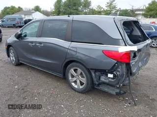 2018 Honda Odyssey EX-L z VIN 5FNRL6H70JB025227, wystawiony jako IAAI lot #41940992 z przebiegiem 95 797 mil mil oraz . Historia ofert i sprzedaży dostępna na DreamBid. Obrazek 3.