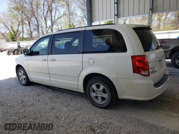2013 Dodge Grand Caravan SXT with VIN 2C4RDGCG5DR554126, listed as a Copart auction lot 52160805 with 201,161 mi miles and Salvage Title. Bid and sale history available at DreamBid. Image 2.
