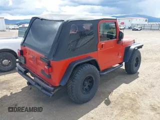 2005 Jeep Wrangler X with VIN 1J4FA39S35P358201, listed as a IAAI auction lot 42080407 with 130,110 mi miles. Bid and sale history available at carsss.com. Image 4.