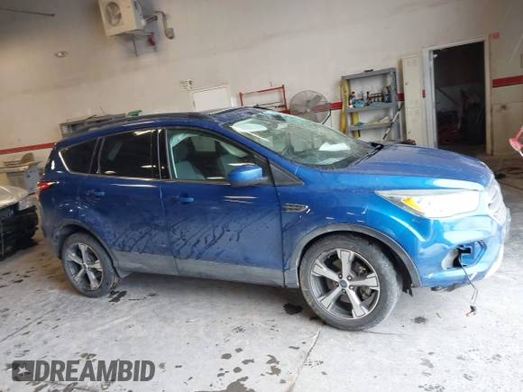 2017 Ford Escape SE z VIN 1FMCU9GD2HUB99955, wystawiony jako IAAI lot #41572200 z przebiegiem 63 023 mil mil oraz . Historia ofert i sprzedaży dostępna na DreamBid. Obrazek 13.
