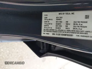 2021 Tesla Model 3 Long Range with VIN 5YJ3E1EB4MF855581, listed as a IAAI auction lot 41974515 with 71,561 mi miles. Bid and sale history available at carsss.com. Image 9.