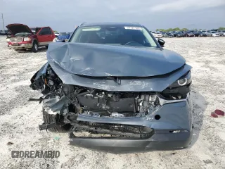 2024 Mazda CX-30 S Carbon Edition с VIN 3MVDMBCMXRM604194, выставлен на аукционе Copart как лот 54777125 с пробегом 9 816 миль миль и Списание • Salvage title. История ставок и продаж доступна на DreamBid. Изображение 5.