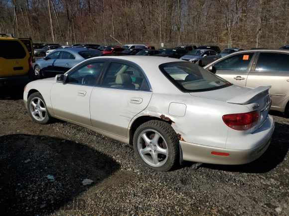 2002 Mazda Millenia S z VIN JM1TA222521733260, wystawiony jako Copart lot #49984755 z przebiegiem 140 212 mil mil oraz Szkoda całkowita • Salvage title. Historia ofert i sprzedaży dostępna na DreamBid. Obrazek 2.