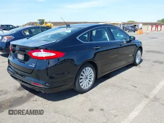 2016 Ford Fusion SE Hybrid with VIN 3FA6P0LU9GR405102, listed as a IAAI auction lot 42358807 with 91,130 mi miles and . Bid and sale history available at DreamBid. Image 4.