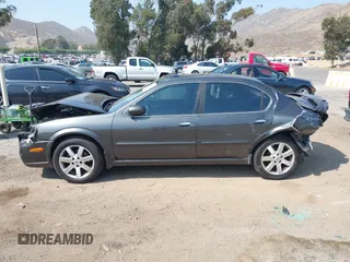 2003 Nissan Maxima GLE z VIN JN1DA31A23T427063, wystawiony jako IAAI lot #42450037 z przebiegiem 166 531 mil mil oraz . Historia ofert i sprzedaży dostępna na DreamBid. Obrazek 13.
