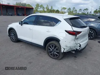 2018 Mazda CX-5 Grand Touring with VIN JM3KFBDM6J0451605, listed as a IAAI auction lot 42099182 with 81,703 mi miles and . Bid and sale history available at DreamBid. Image 3.