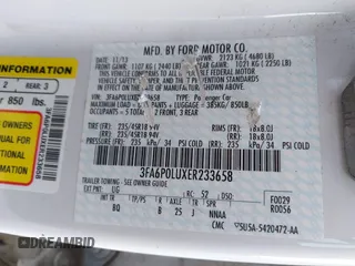 2014 Ford Fusion SE Hybrid with VIN 3FA6P0LUXER233658, listed as a IAAI auction lot 42311588 with 106,282 mi miles and . Bid and sale history available at DreamBid. Image 9.