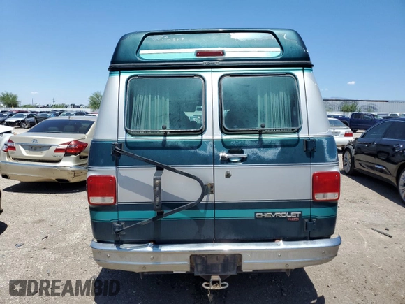 1994 Chevrolet Chevy Van z VIN 1GBEG25K9RF176079, wystawiony jako Copart lot #65824634 z przebiegiem 180 507 mil mil oraz Czysty tytuł • Clean title. Historia ofert i sprzedaży dostępna na DreamBid. Obrazek 6.