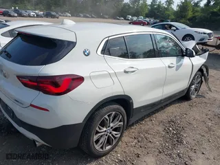2022 BMW X2 sDrive28i with VIN WBXYH9C04N5U11829, listed as a IAAI auction lot 40184510 with 59,426 mi miles. Bid and sale history available at carsss.com. Image 4.