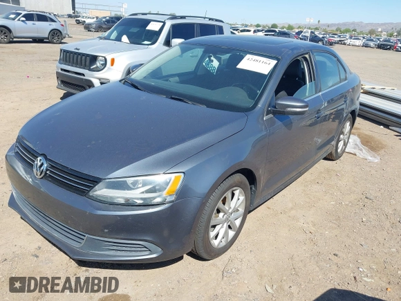 2014 Volkswagen Jetta SE z VIN 3VWD17AJXEM417724, wystawiony jako IAAI lot #42481164 z przebiegiem 98 613 mil mil oraz . Historia ofert i sprzedaży dostępna na DreamBid. Obrazek 2.