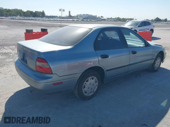 1995 Honda Accord DX with VIN 1HGCD562XSA045128, listed as a IAAI auction lot 40563511 with 143,206 mi miles. Bid and sale history available at carsss.com. Image 4.