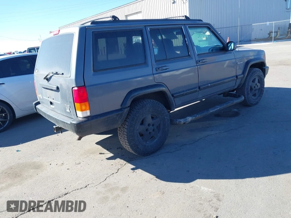 1997 Jeep Cherokee Sport with VIN 1J4FJ68S4VL567490, listed as a IAAI auction lot 41659872 with 404,766 mi miles. Bid and sale history available at carsss.com. Image 4.