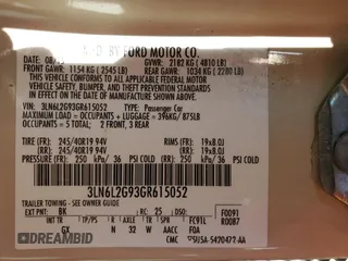 2016 Lincoln MKZ z VIN 3LN6L2G93GR615052, wystawiony jako Copart lot #54717335 z przebiegiem 86 575 mil mil oraz Szkoda całkowita • Salvage title. Historia ofert i sprzedaży dostępna na DreamBid. Obrazek 13.