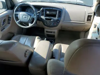 2002 Mazda Tribute LX with VIN 4F2YU08112KM16716, listed as a Copart auction lot 55095645 with 113,885 mi miles and Salvage Title. Bid and sale history available at DreamBid. Image 8.