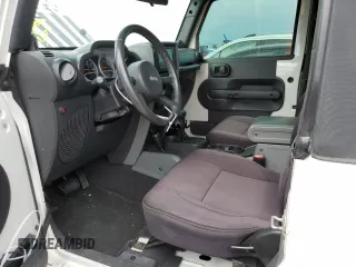 2009 Jeep Wrangler Rubicon with VIN 1J4GA64149L707142, listed as a Copart auction lot 76387344 with Not Provided miles and Salvage Title. Bid and sale history available at DreamBid. Image 7.