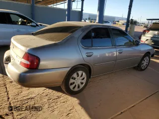 2001 Nissan Altima GXE with VIN 1N4DL01D21C186267, listed as a Copart auction lot 80228694 with 145,442 mi miles and Salvage Title. Bid and sale history available at carsss.com. Image 3.