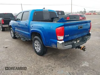 2016 Toyota Tacoma SR with VIN 5TFCZ5AN4GX013233, listed as a IAAI auction lot 41394610 with 142,099 mi miles and . Bid and sale history available at DreamBid. Image 3.